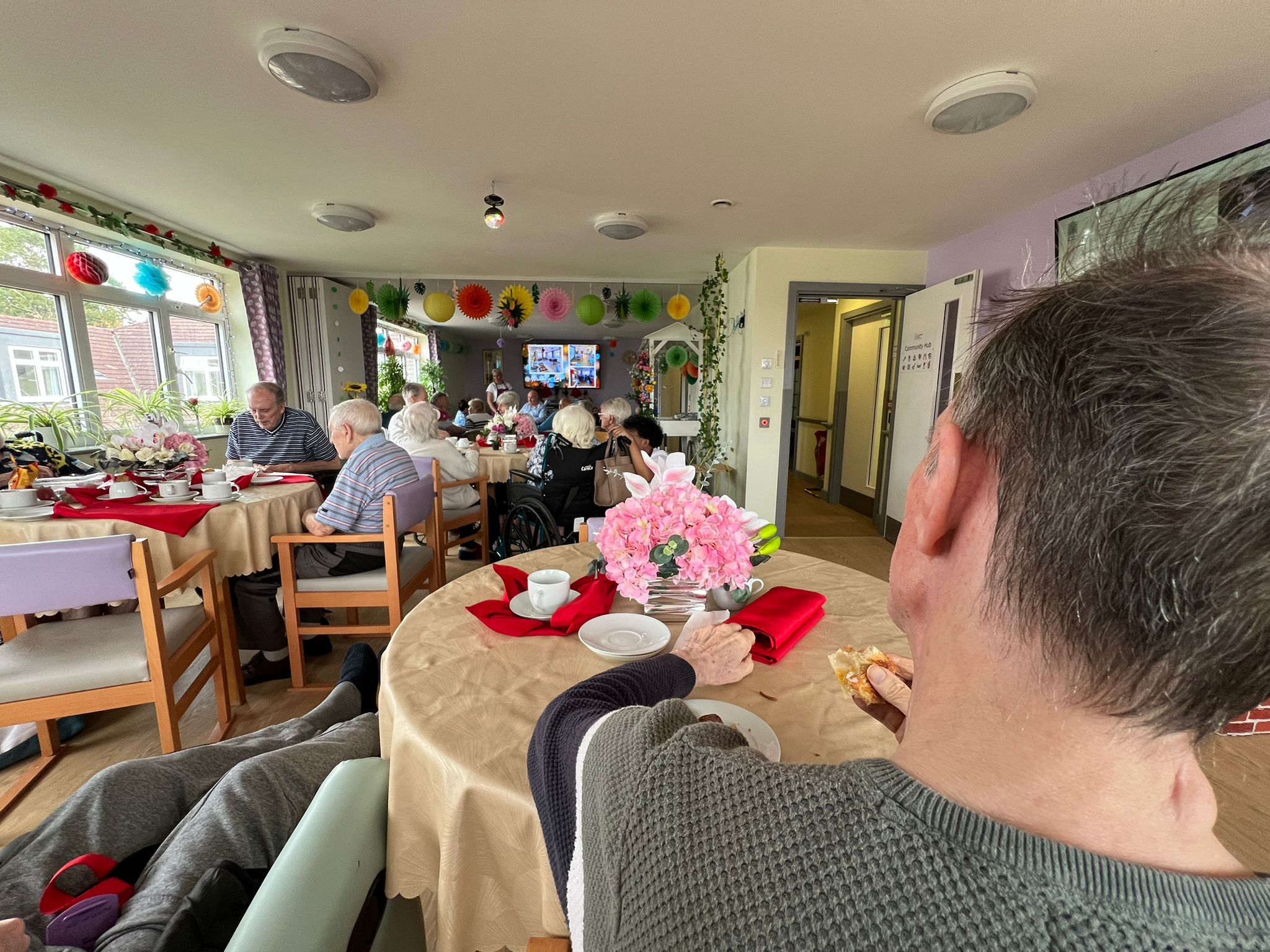 People sitting on the beach at night with an astonishing view of the milky way.
