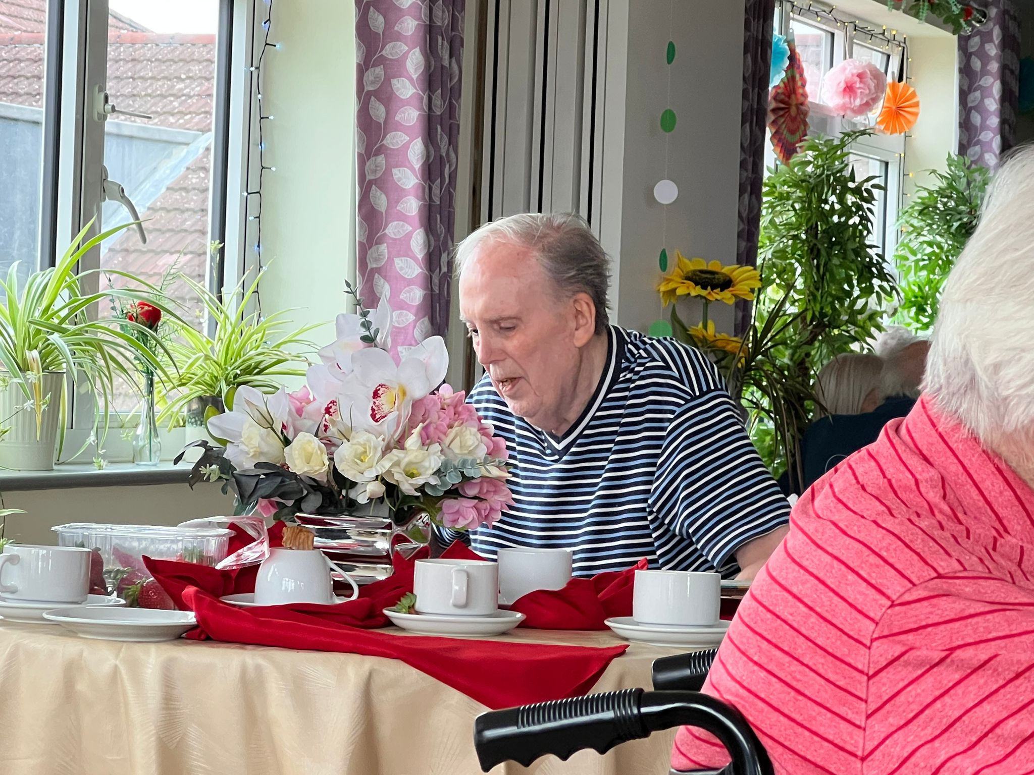 People sitting on the beach at night with an astonishing view of the milky way.